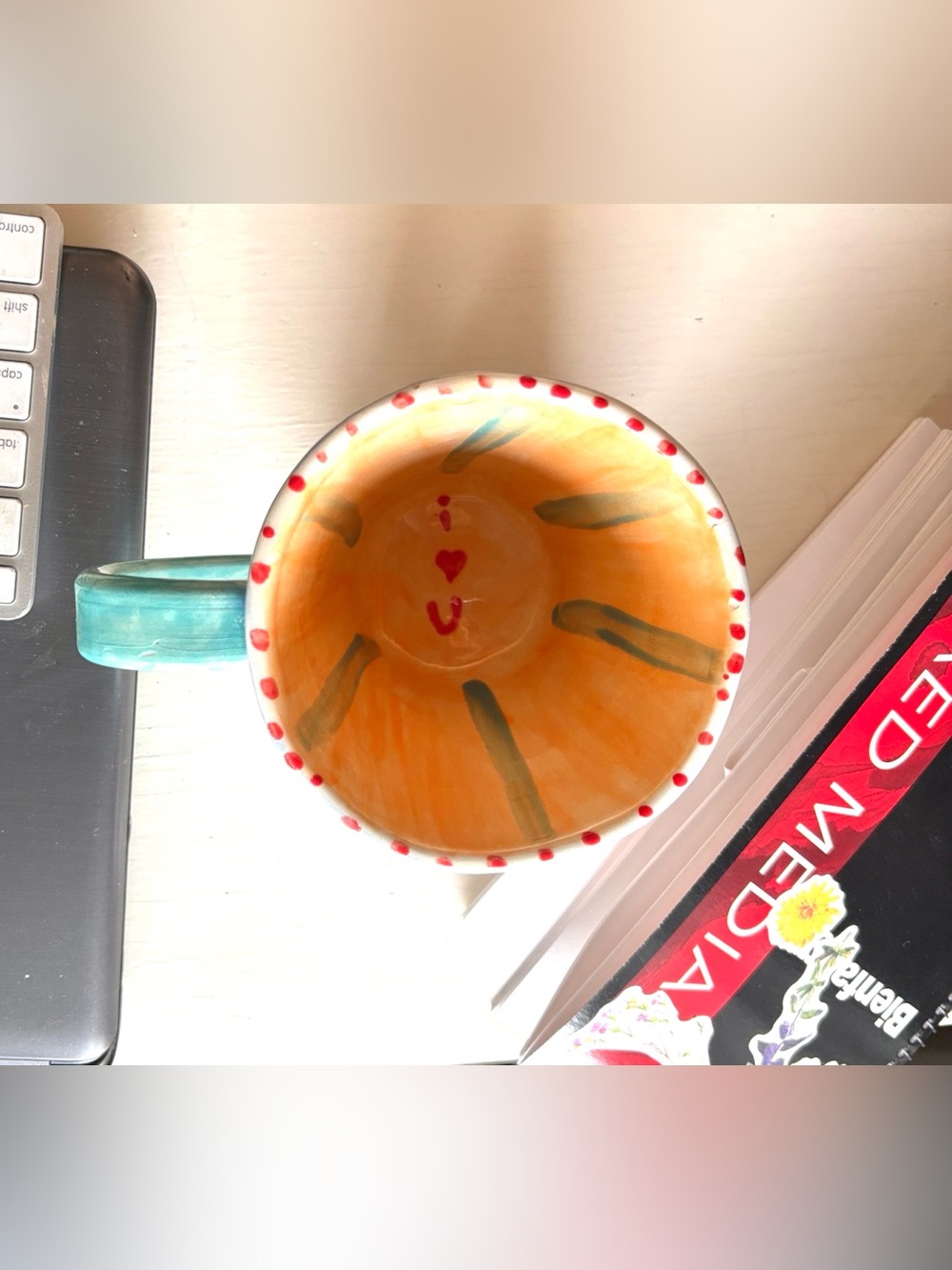 Vibrant Ceramic Art Cup with Orange and Blue Accents